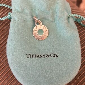 Tiffany & Co. charm, silver with blue enamel.